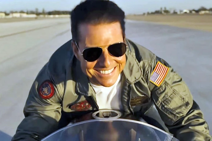 Tom Cruise in "Top Gun: Maverick" riding a motorcycle.