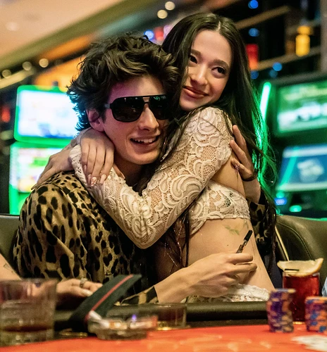 Mikey Madison and Mark Eydelshteyn in a scene from Anora (2024) in a casino.