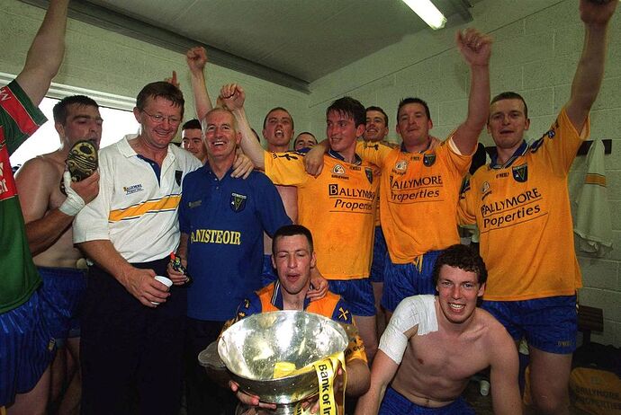 Roscommon players and management - including John Tobin and Brian Talty, two former Galway stars - celebrate in their dressing room following their 2001 Connacht SFC final victory over Mayo at Hyde Park in July 2001. Photo: David Maher/Sportsfile