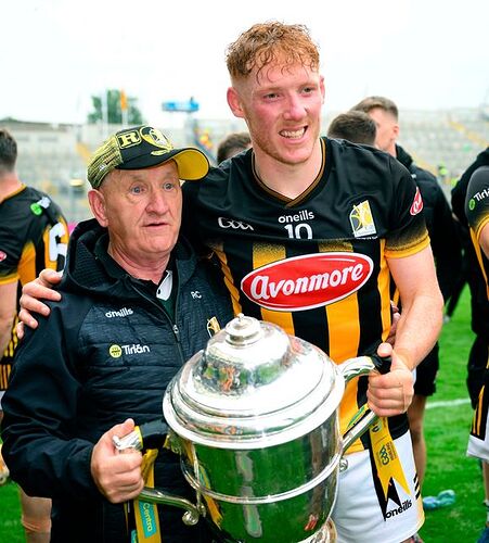 Kilkenny kit man 'Rackard' Cody, holding the Bob O'Keeffe Cup, celebrates with Kilkenny captain John Donnelly. Photo: Ray McManus/Sportsfile