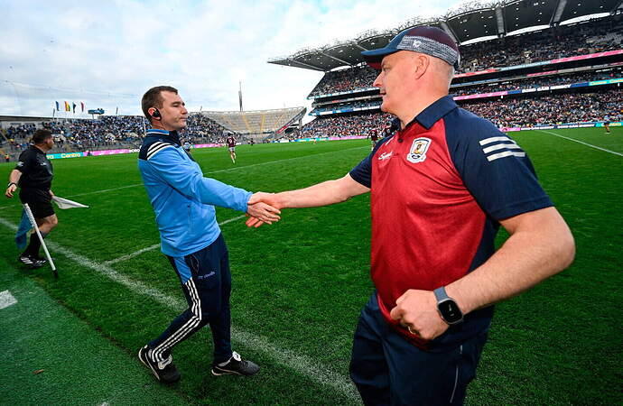 Galway manager Micheál Donoghue, right, shakes hands with Dublin manager Niall Ó Ceallacháin after the Leinster final