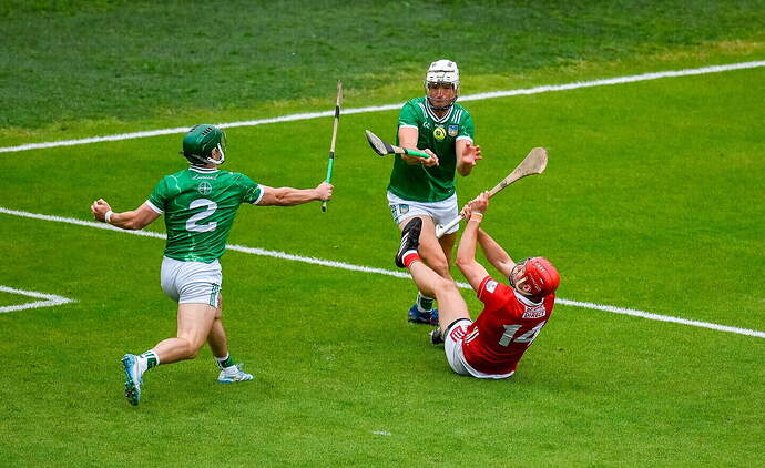Cork’s Brian Hayes shoots to score his side's second goal despite the efforts of Limerick’s Kyle Hayes