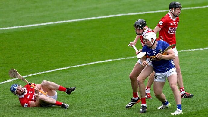 Cork’s Seán O'Donoghue injured after an incident with Darragh McCarthy (13) of Tipperary that resulted in a red card. Pic: James Crombie