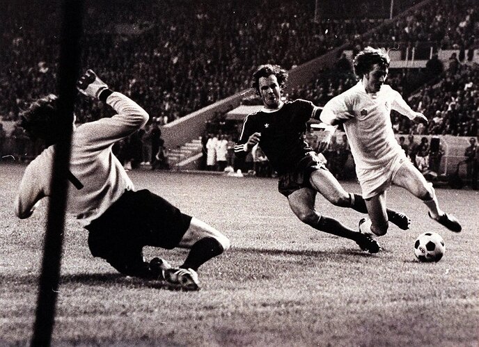 Franz Beckenbauer brings down Allan Clarke with no penalty given during the Bayern Munich v Leeds European Cup Final.