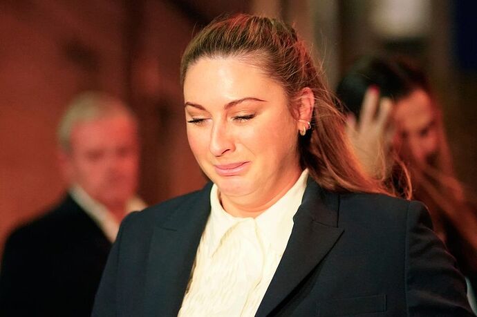 Nikita Hand speaking outside court. Photo: Brian Lawless/ PA